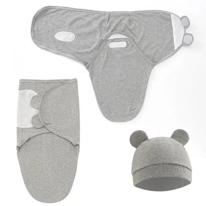 Couverture emmaillotage grise déployée détails fermetures scratchs bonnet oreilles  doudou sommeil nourrisson confort.