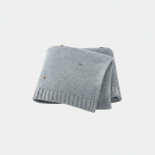 Couverture bebe tricot gris points brodés colorés fond gris clair