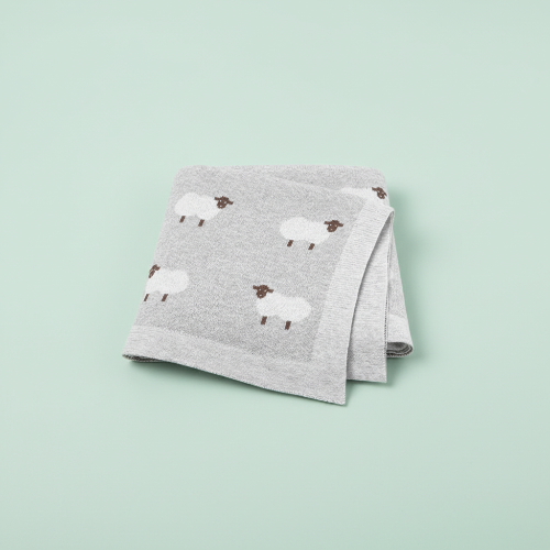 Couverture bebe tricot grise motif moutons fond vert pâle