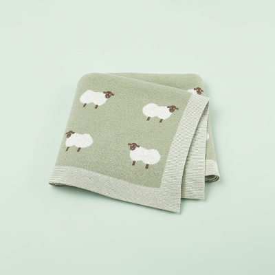 Couverture bebe tricot verte-motif-moutons fond vert pâle
